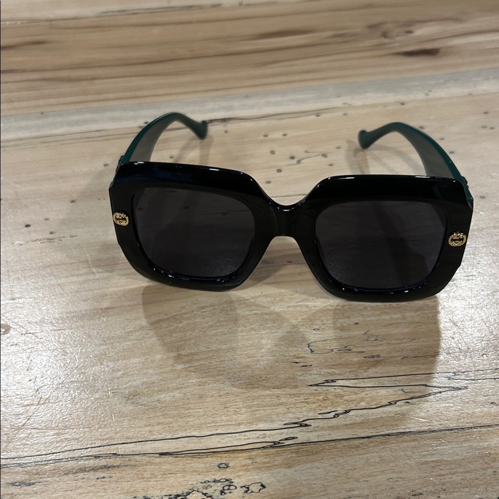 Gucci Black Sunglasses with Gold Logo Accents
